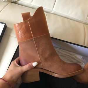 Short boots by Chanel. Never been worn.
